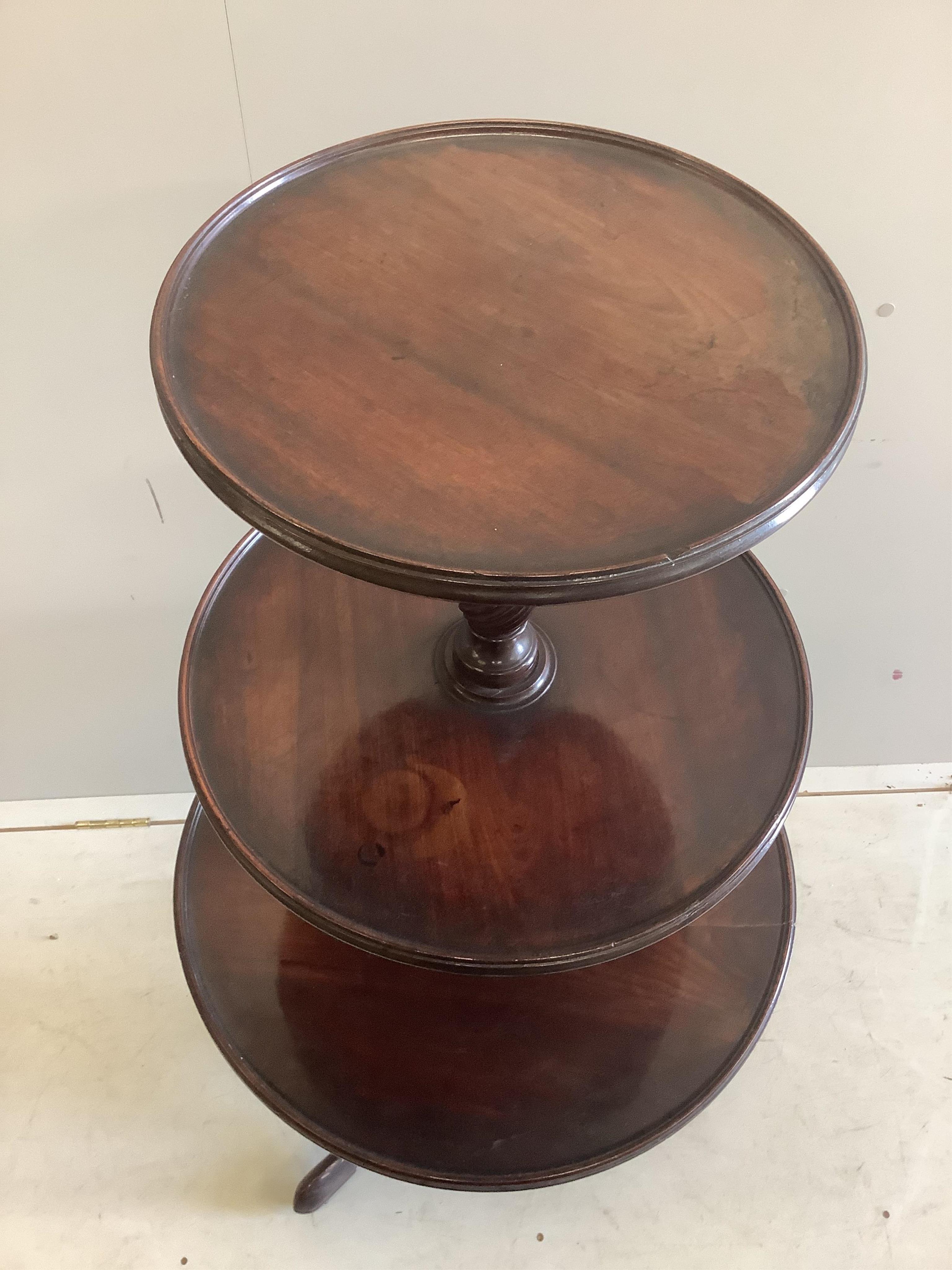 An early 19th century mahogany three tier dumb waiter, diameter 62cm, height 120cm
